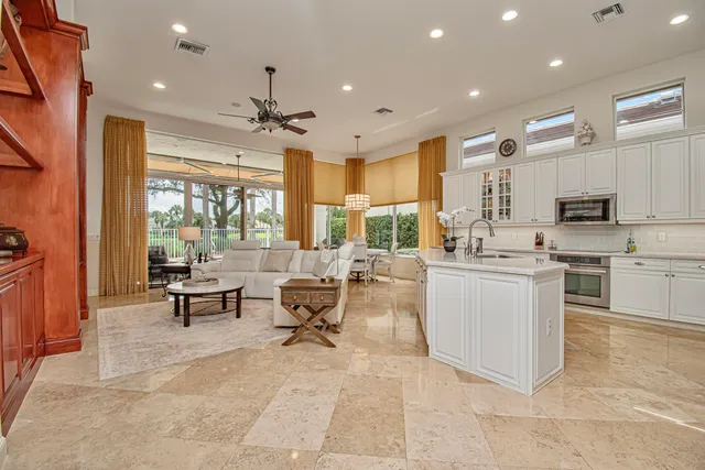a bathroom with a granite countertop bathtub sink vanity and mirror