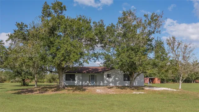 a view of a swimming pool with an outdoor seating