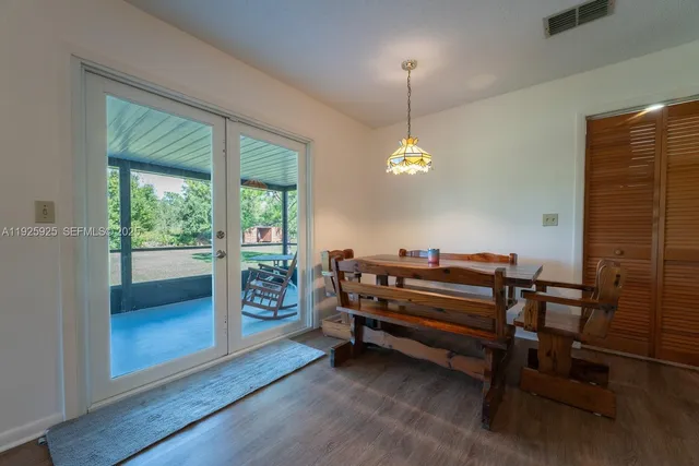 a view of a livingroom with furniture and a window