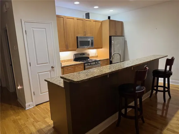 a kitchen with a sink and a refrigerator