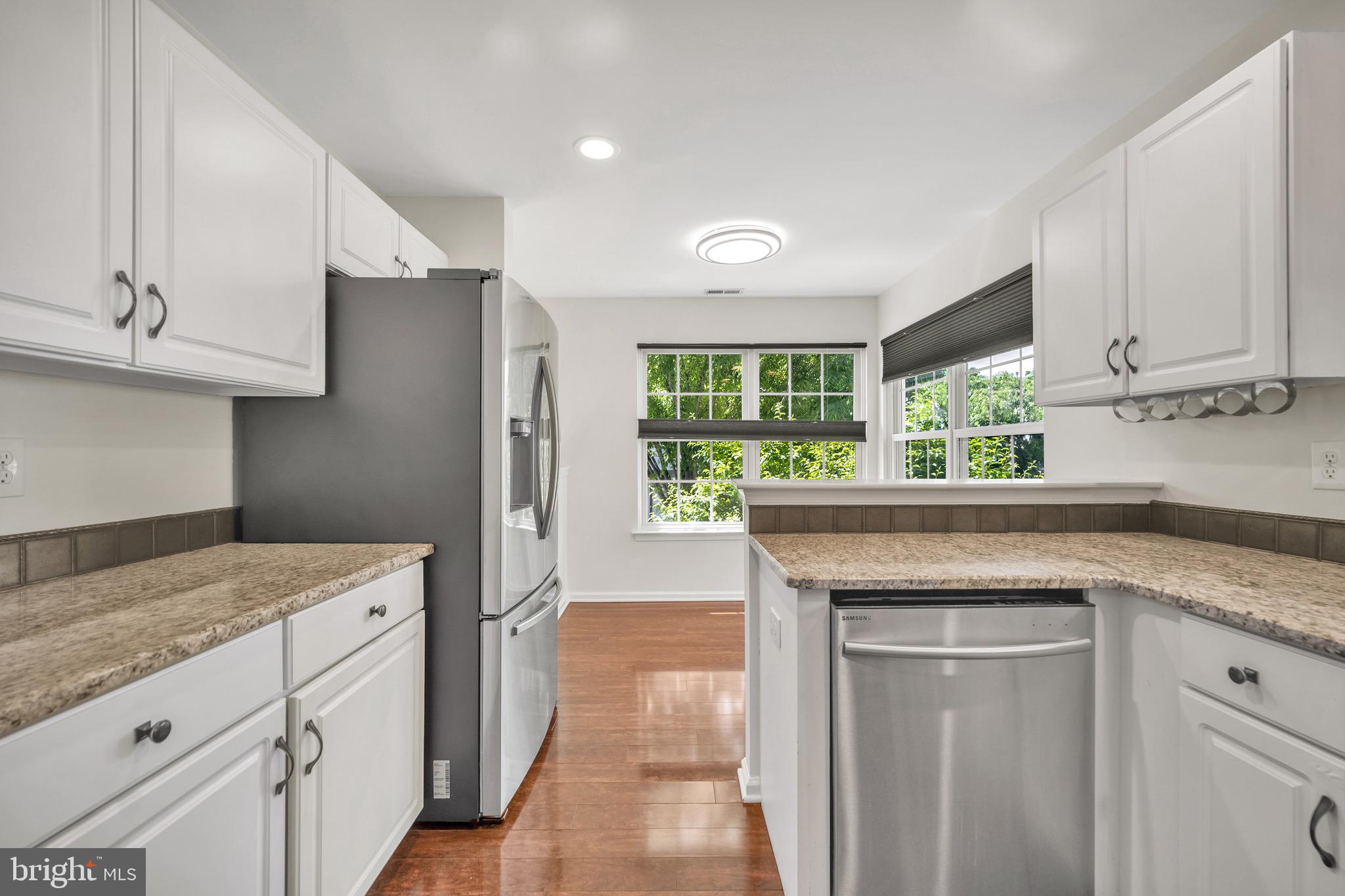 2402 Waterford Road, Unit 94 Yardley, PA 19067 - Photo 2 of 28 a kitchen with a stove and a refrigerator