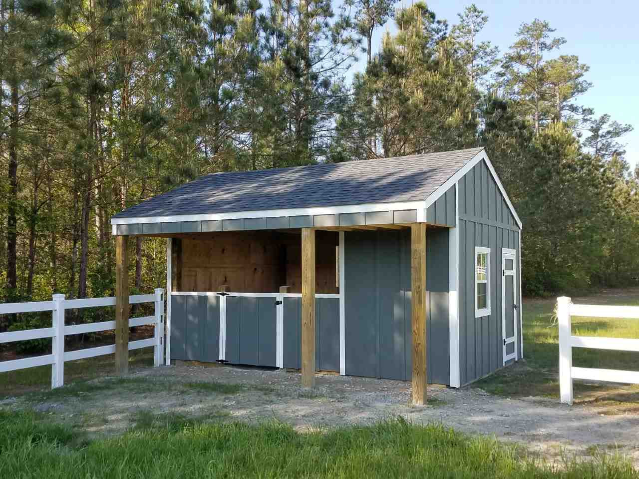 1522 Freedom Road Smithfield, NC 27577 - Photo 24 of 25 16’x18’ included 12’x12’ stall, 4’ overhang and 6’x12’ tack/feed storage room. Run-in/tack storage Shelter