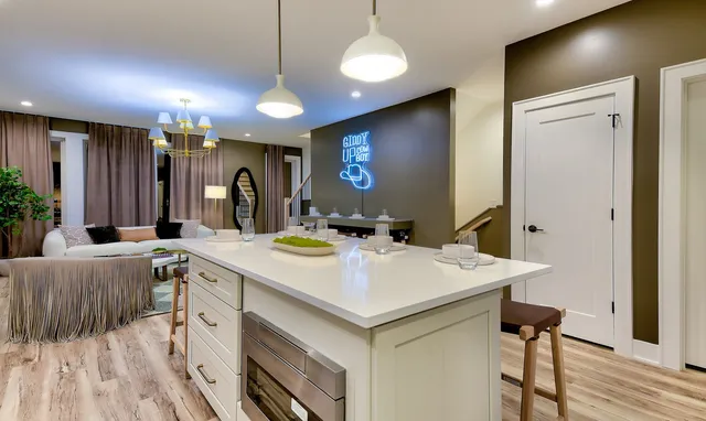 a view of a kitchen counter space and wooden floor