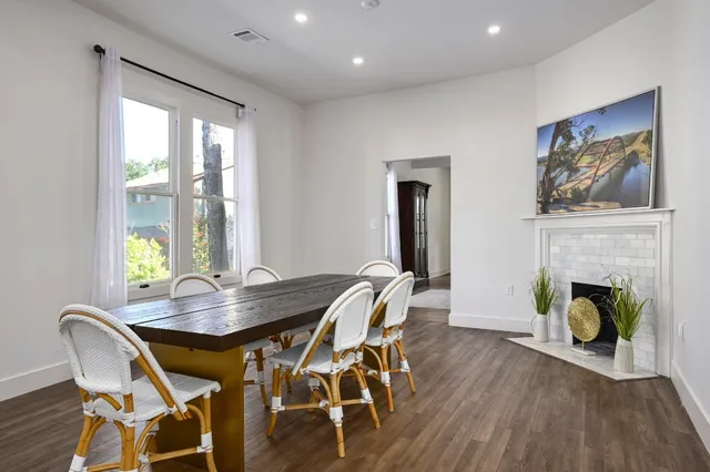 a view of a dining room with furniture window and wooden floor