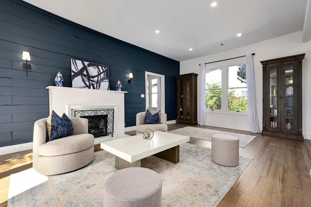 a living room with furniture and a fireplace