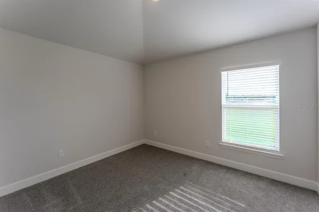 a bathroom with a granite countertop sink mirror toilet and bathtub