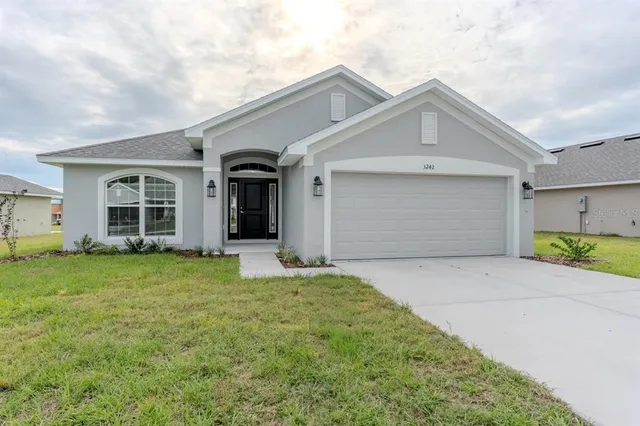 front view of a house with a yard