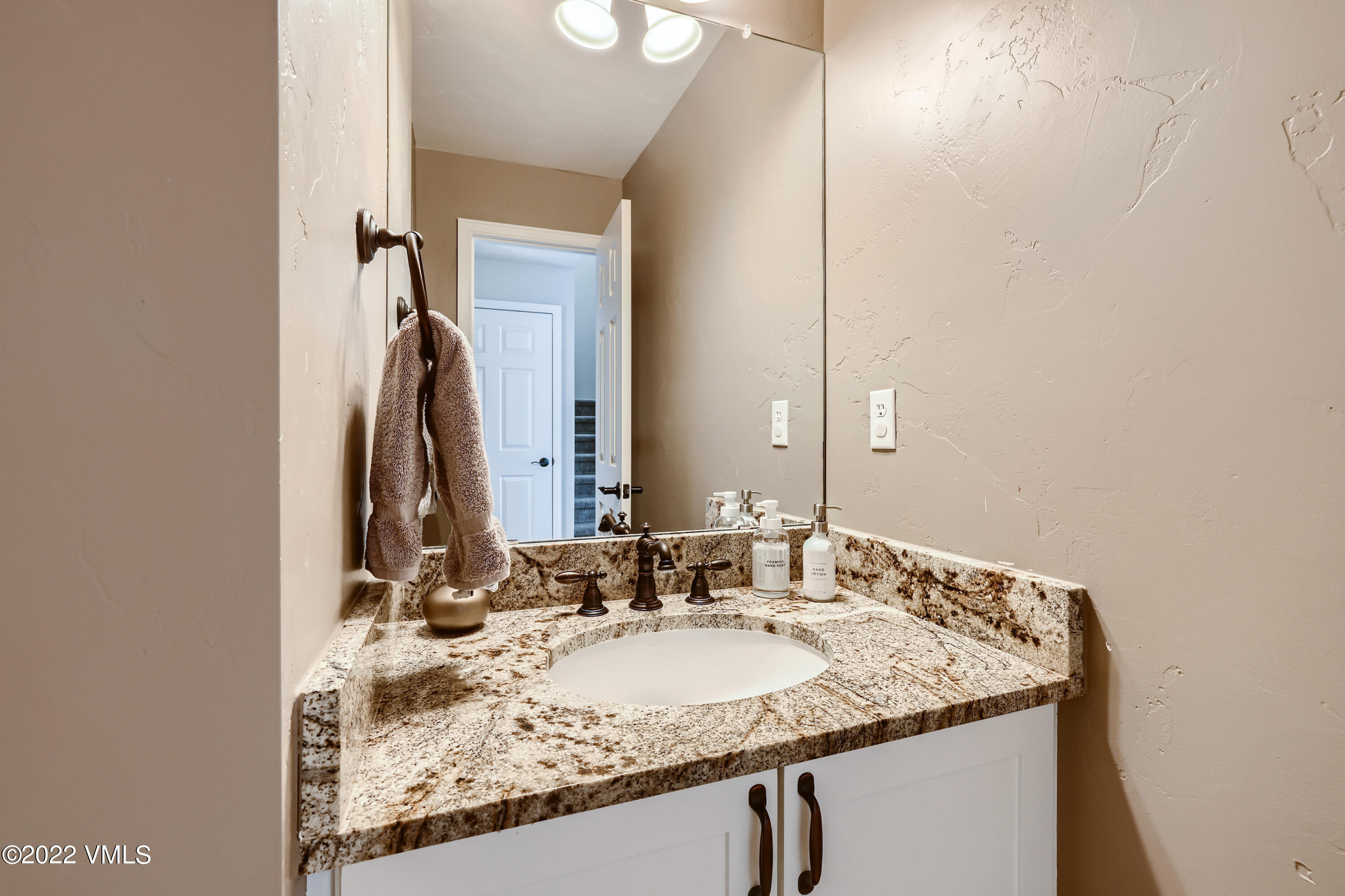 279 Longview Avenue Eagle, CO 81631 - Photo 11 of 30 a bathroom with a granite countertop sink and a mirror
