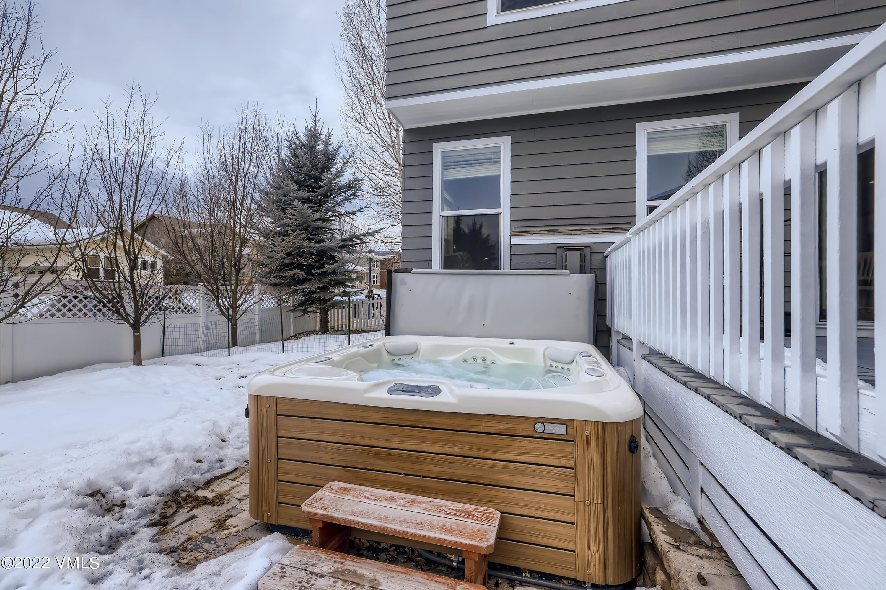 279 Longview Avenue Eagle, CO 81631 - Photo 13 of 30 a view of a house with a bed and chair under an umbrella