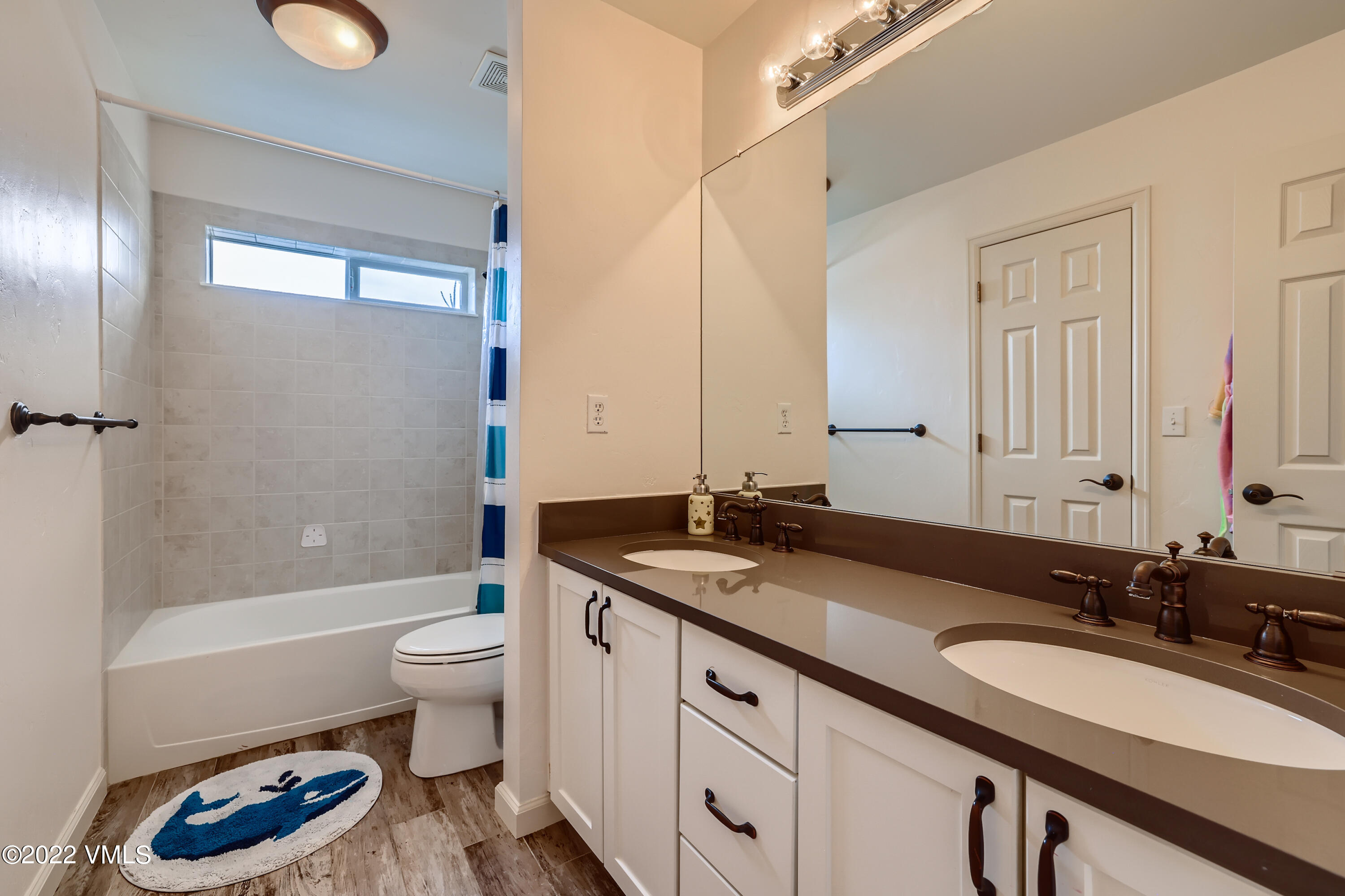 279 Longview Avenue Eagle, CO 81631 - Photo 16 of 30 a bathroom with a granite countertop sink mirror vanity and toilet