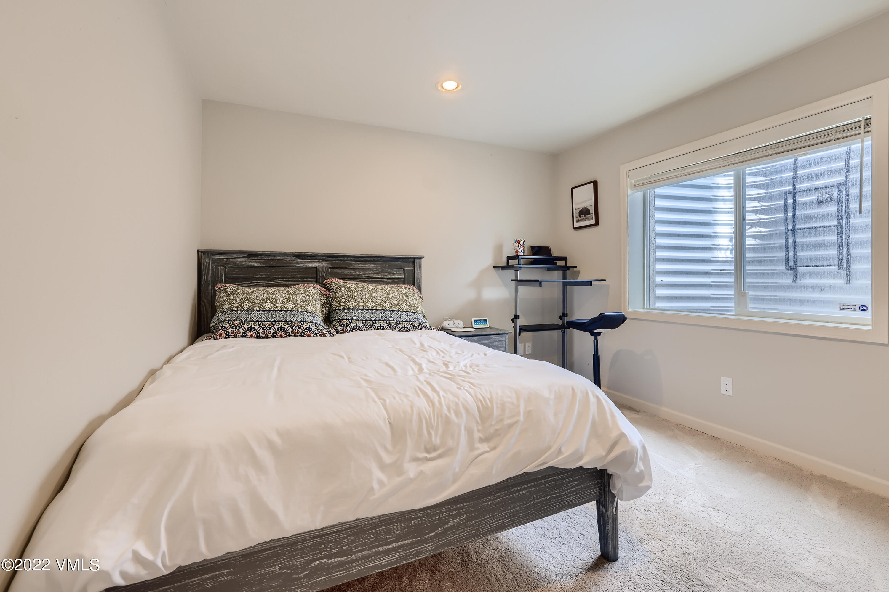 279 Longview Avenue Eagle, CO 81631 - Photo 25 of 30 a bed sitting in a bedroom next to a window