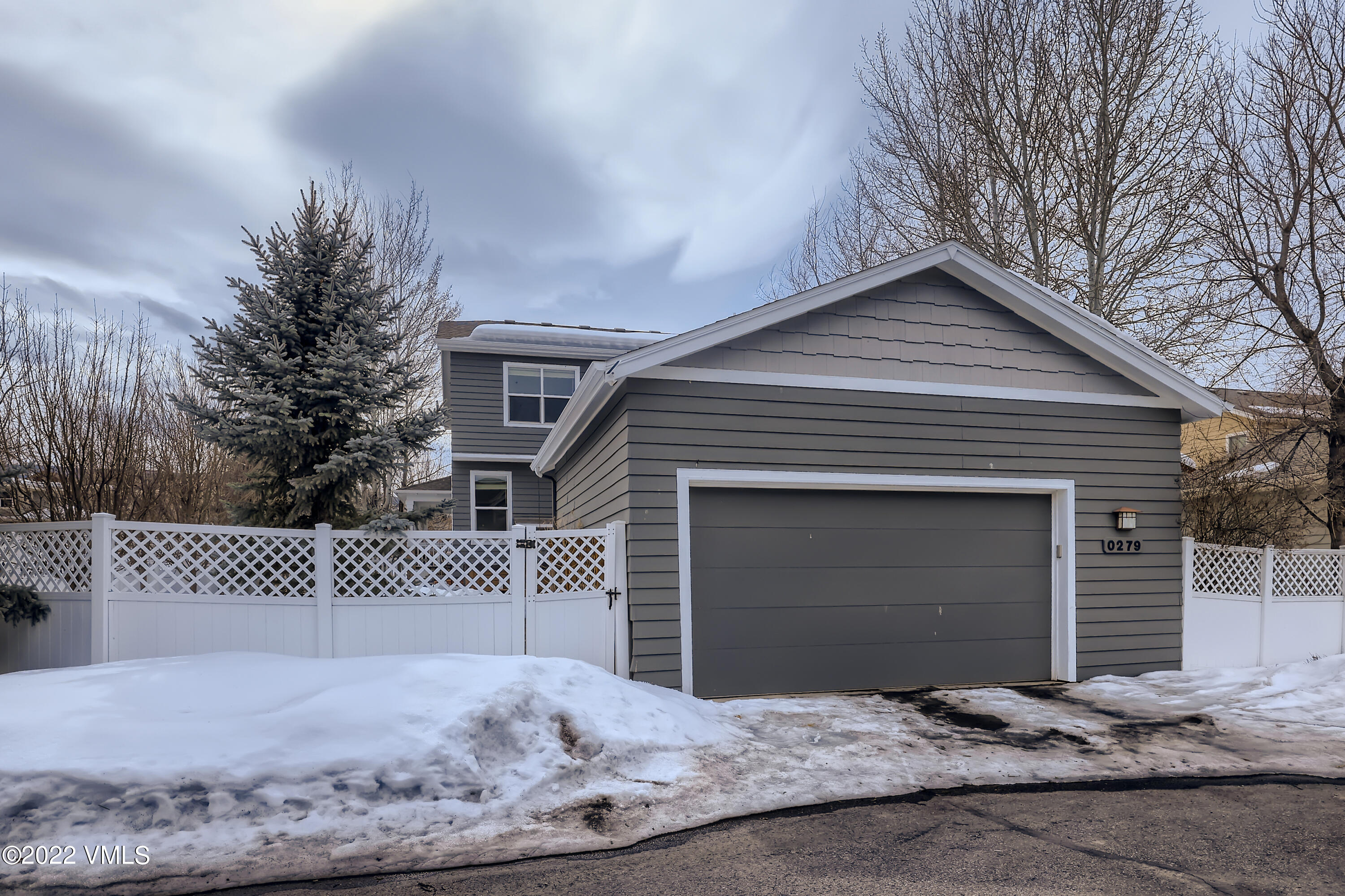 279 Longview Avenue Eagle, CO 81631 - Photo 27 of 30 a front view of a house with a yard and garage