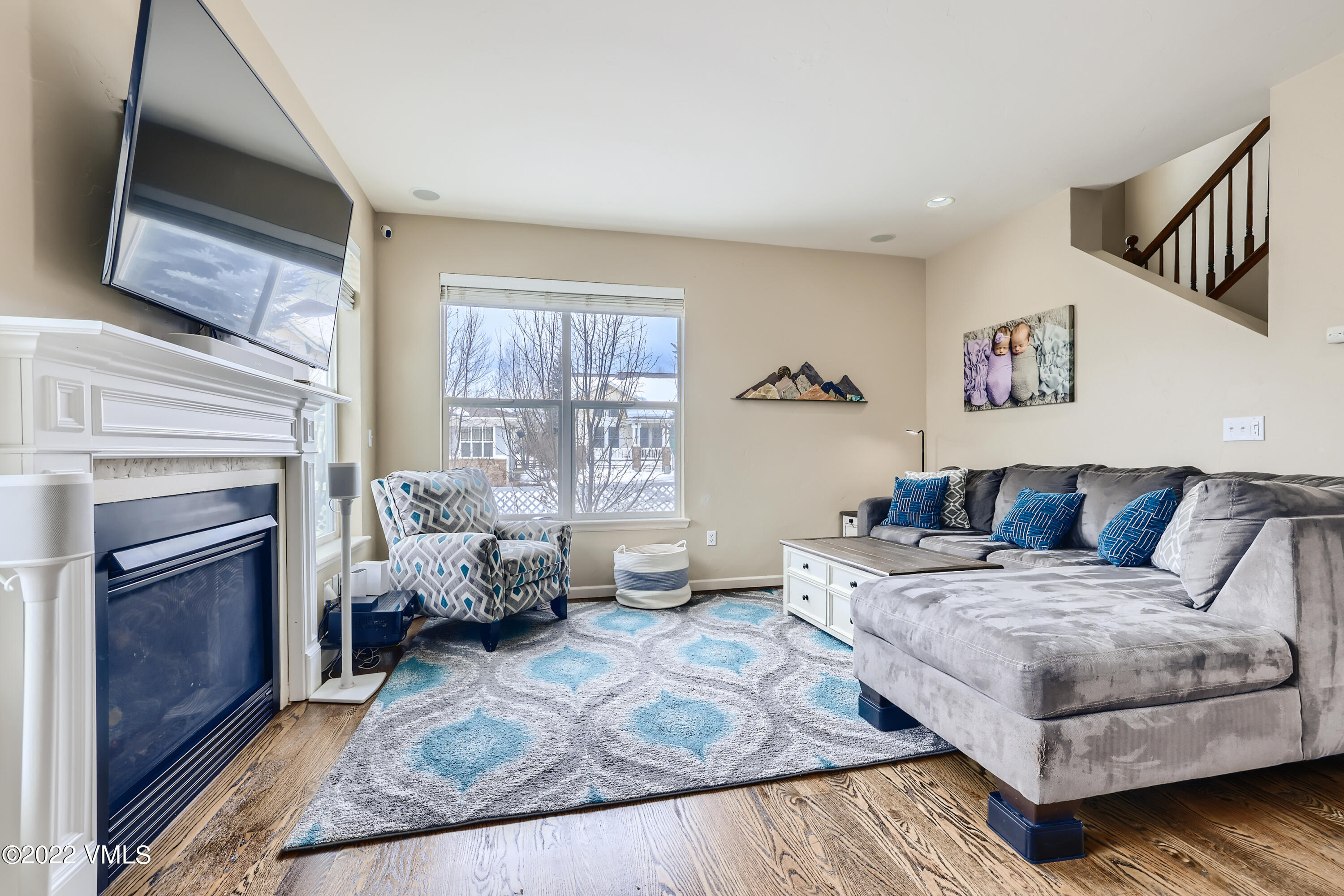 279 Longview Avenue Eagle, CO 81631 - Photo 7 of 30 a living room with furniture large window and a fireplace