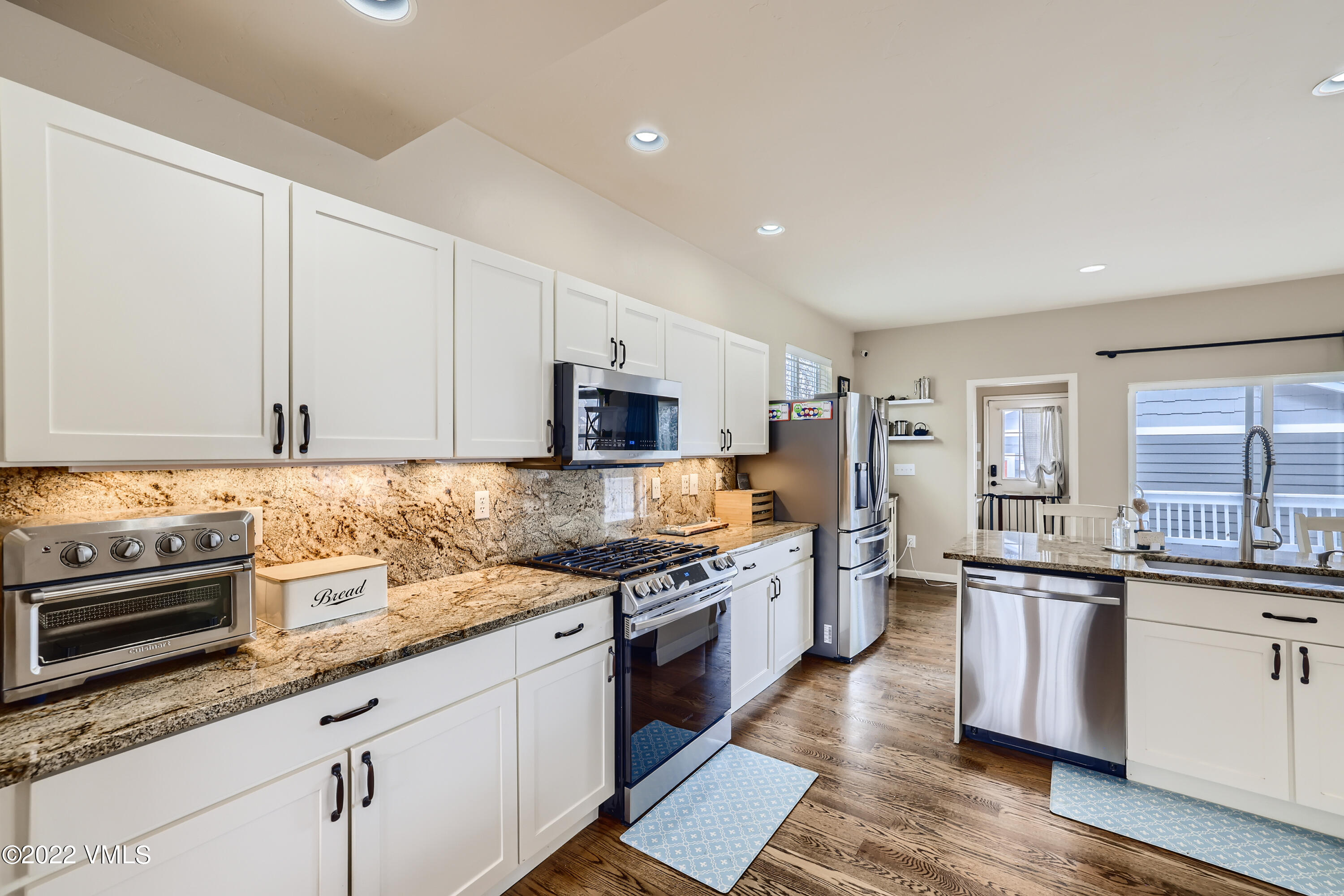 279 Longview Avenue Eagle, CO 81631 - Photo 9 of 30 a kitchen with stainless steel appliances granite countertop a stove top oven a sink and dishwasher