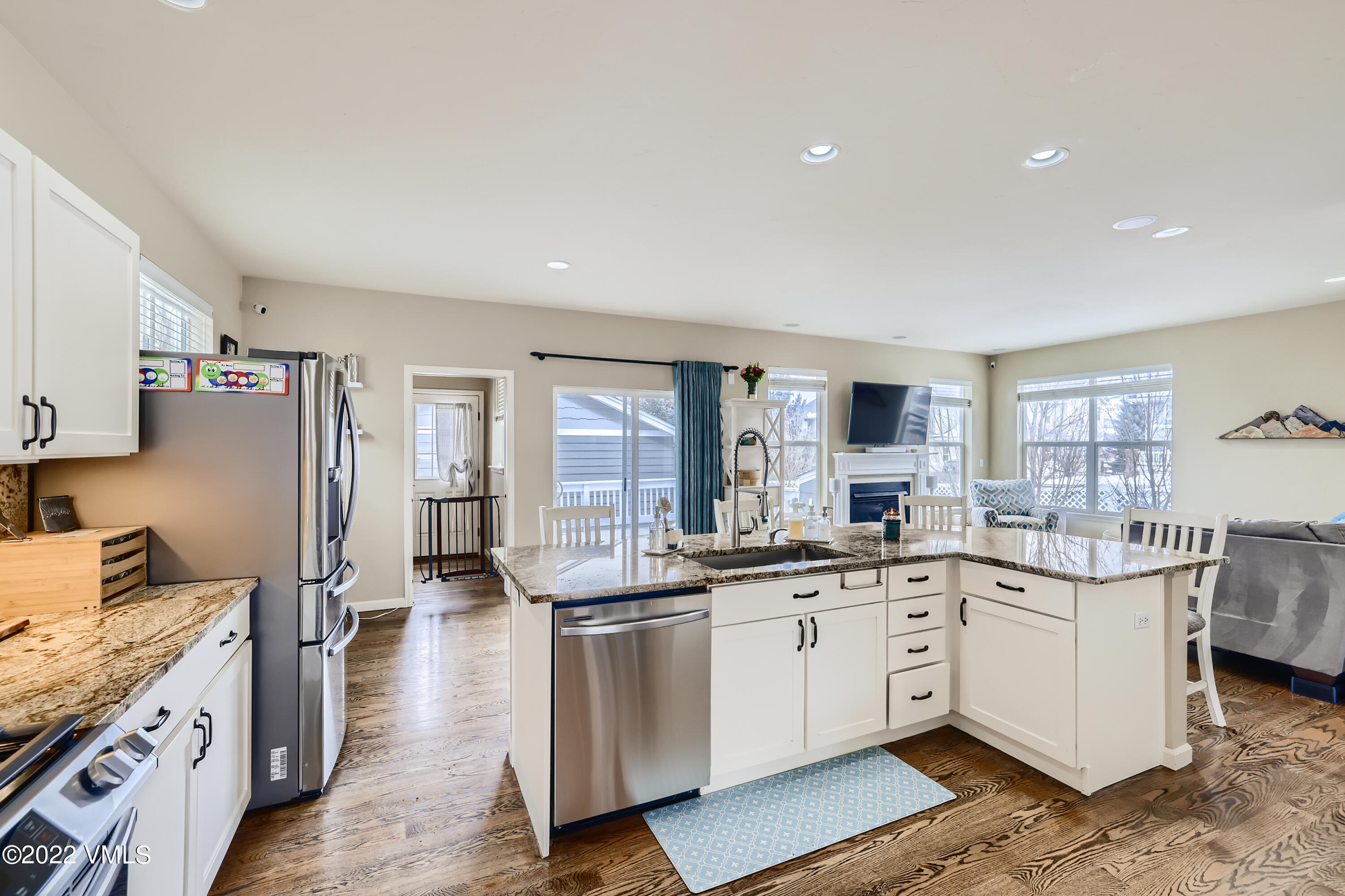279 Longview Avenue Eagle, CO 81631 - Photo 10 of 30 a kitchen with a sink stove cabinets and wooden floor