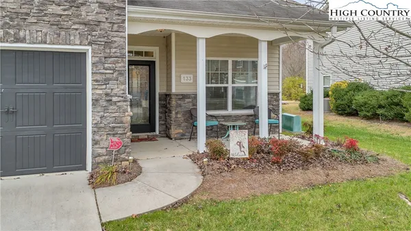 a front view of a house with a porch