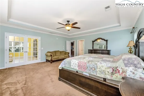 a bedroom with bed and window