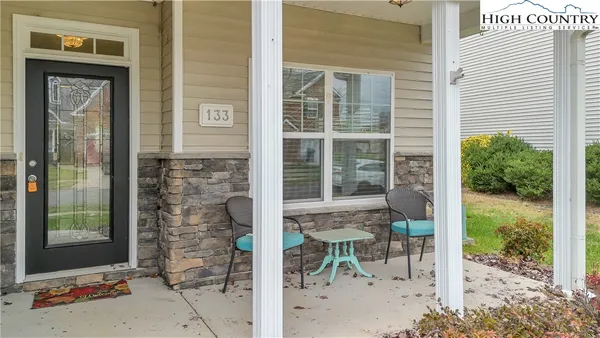 a view of a door with a bench and a bench in front of glass door