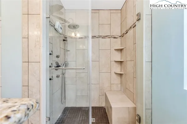 a bathroom with a sink and shower