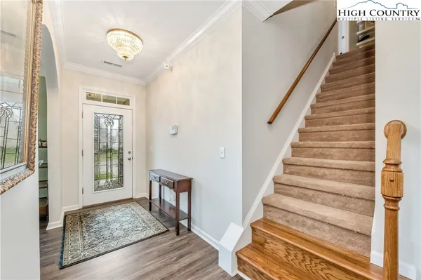 a view of entryway with wooden floor