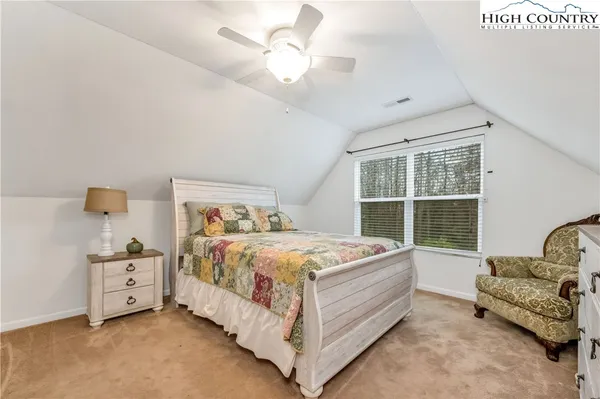 a bed room with a bed and window