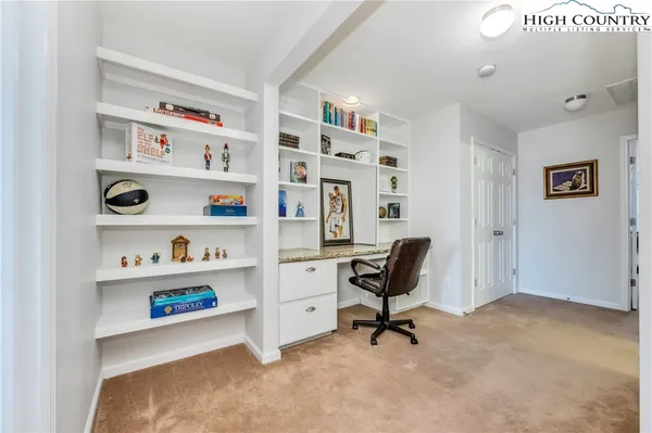 a view of a workspace with furniture