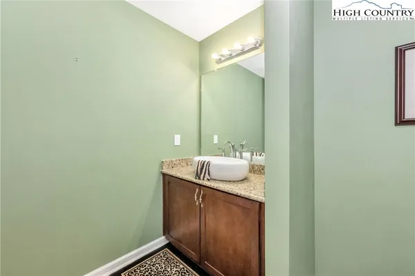 a bathroom with a sink and mirror