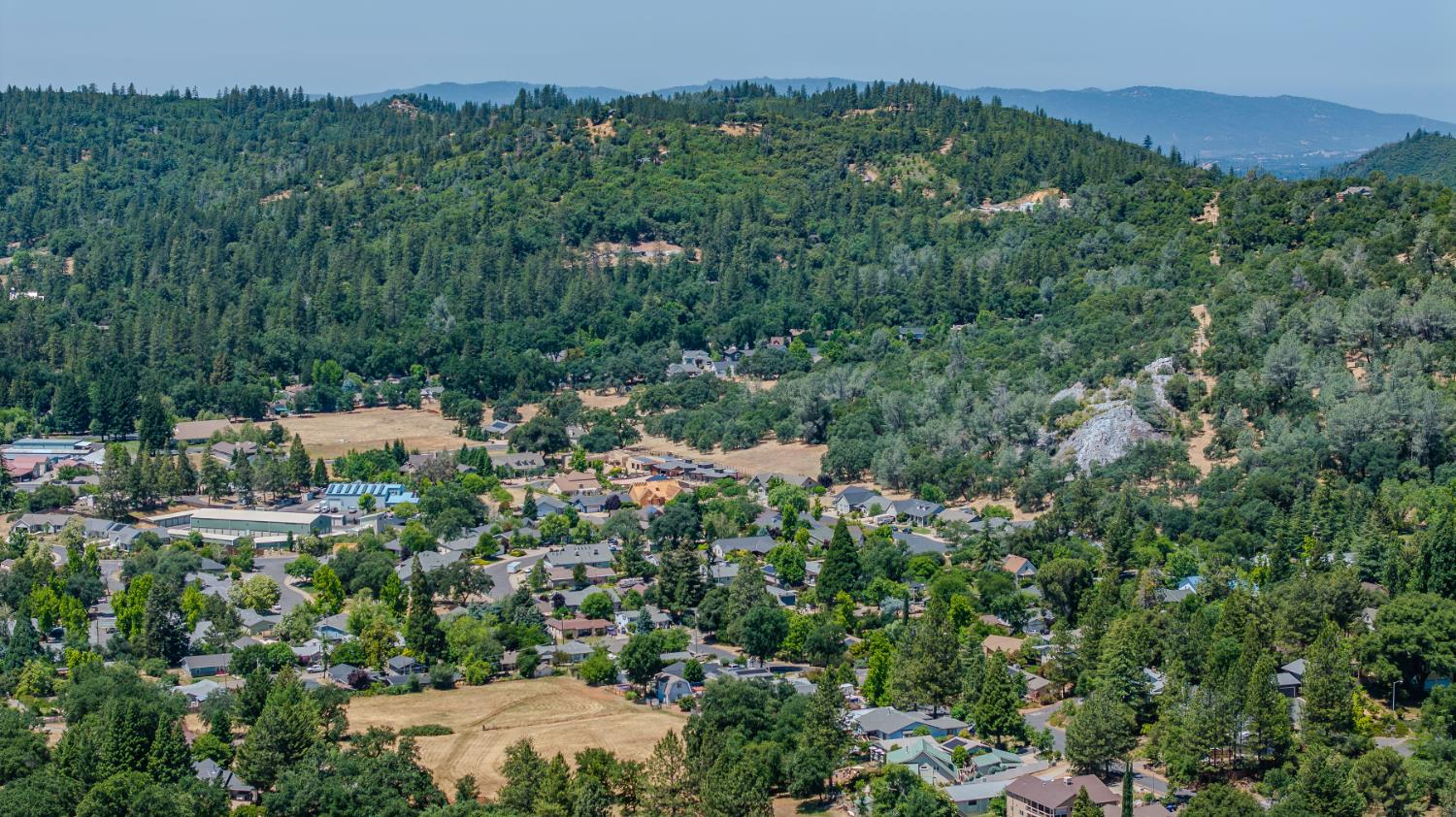 Undisclosed Address Murphys, CA 95247 - Photo 43 of 52 an aerial view of residential house with outdoor space and trees all around