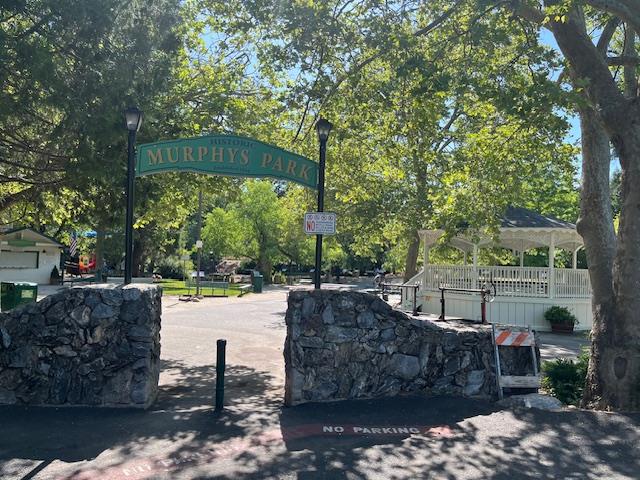 Undisclosed Address Murphys, CA 95247 - Photo 50 of 52 a view of a street with a bench and trees