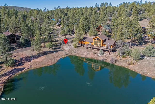 a aerial view of a house with a yard