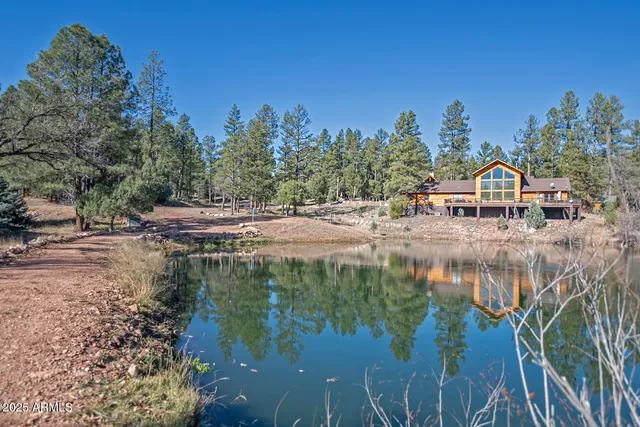 a view of a lake with a house in the background