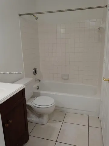 a bathroom with a sink a toilet and a bathtub