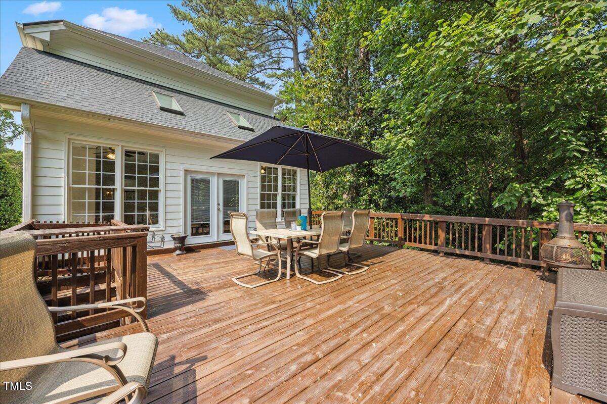 2725 Rosedale Avenue Raleigh, NC 27607 - Photo 48 of 66 Large grilling deck off main family room with stairs down to fenced yard
