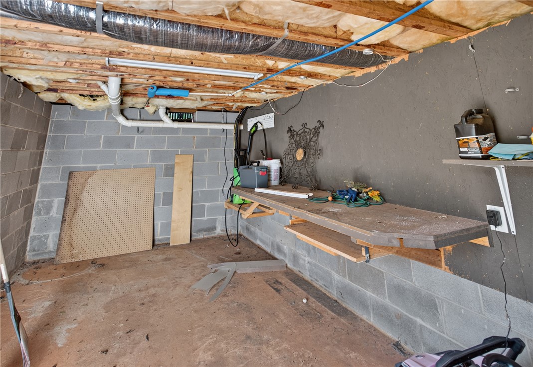 612 Providence Point Drive Seneca, SC 29678 - Photo 25 of 43 A well-lit unfinished basement offers ample space for a functional workshop.
