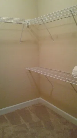 a view of a room with racks on the wall