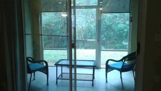 a view of a room with chairs and furniture