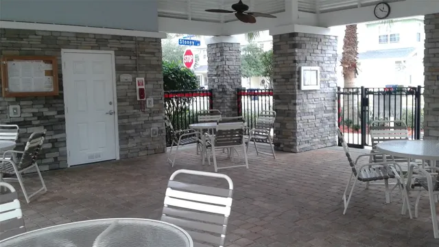 a room with lots of furniture and a potted plant