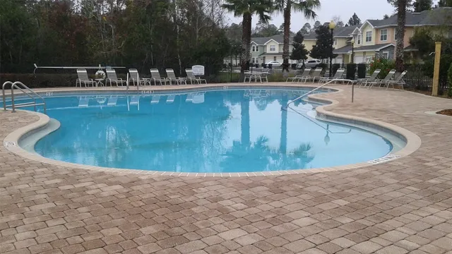 a view of swimming pool with outdoor seating