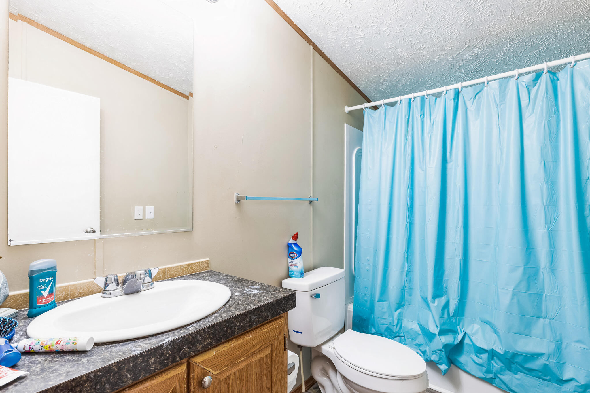 199 Snowden Lane Penhook, VA 24137 - Photo 11 of 15 a bathroom with a granite countertop toilet sink and mirror