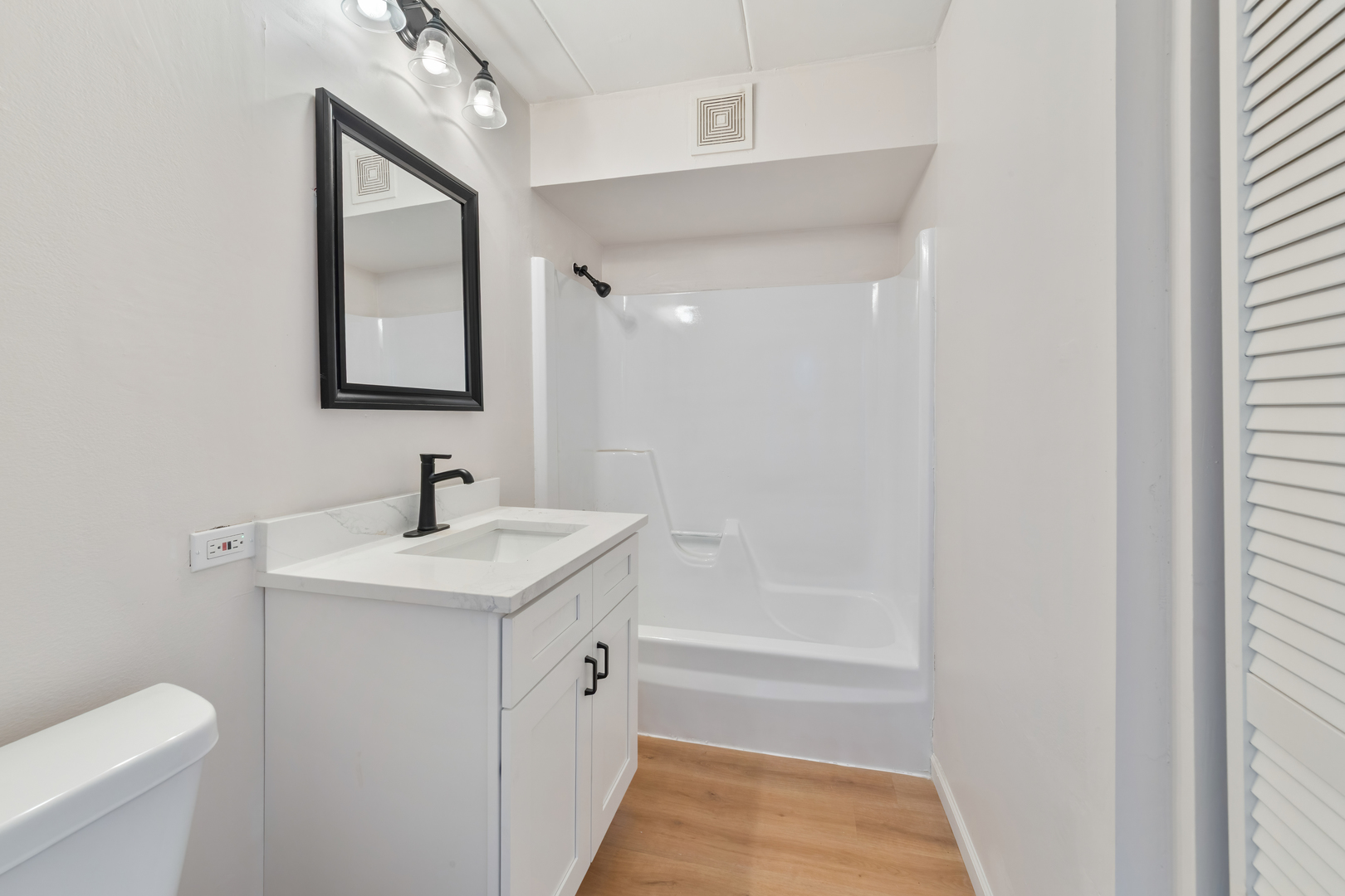 17000 Novak Drive, Unit T105 Hazel Crest, IL 60429 - Photo 7 of 15 a bathroom with a sink a toilet and shower