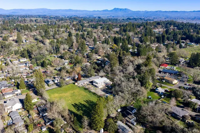 an aerial view of a house with a garden
