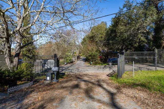 a room with furniture or couch and a view of kitchen