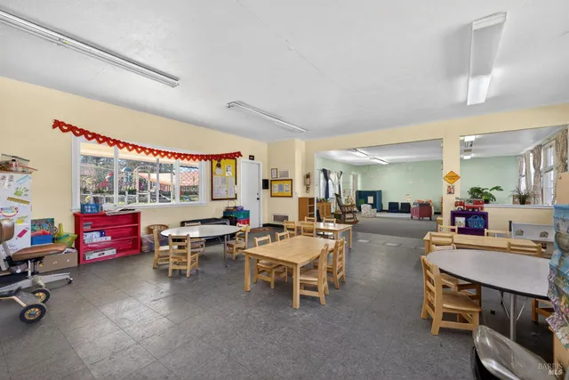 a kitchen with stainless steel appliances granite countertop a stove and a refrigerator