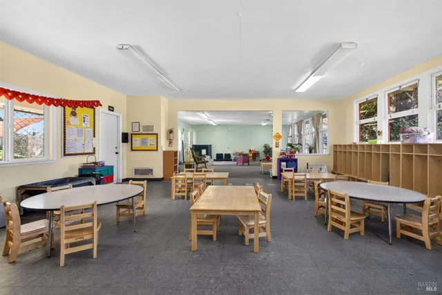 a kitchen with stainless steel appliances kitchen island granite countertop a sink and cabinets