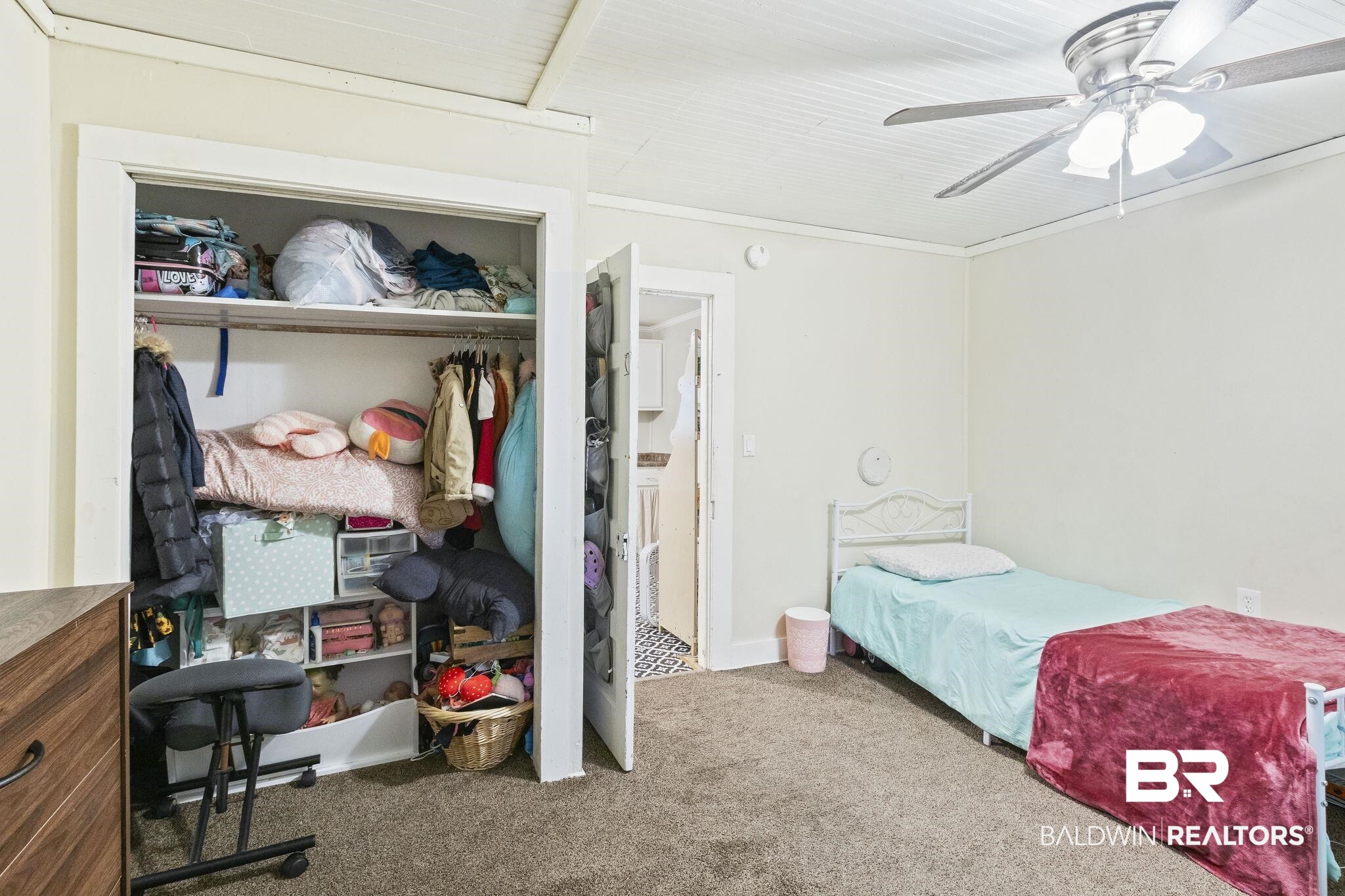 707 North Cedar Street Foley, AL 36535 - Photo 27 of 69 Bedroom with ceiling fan, carpet floors, and a closet