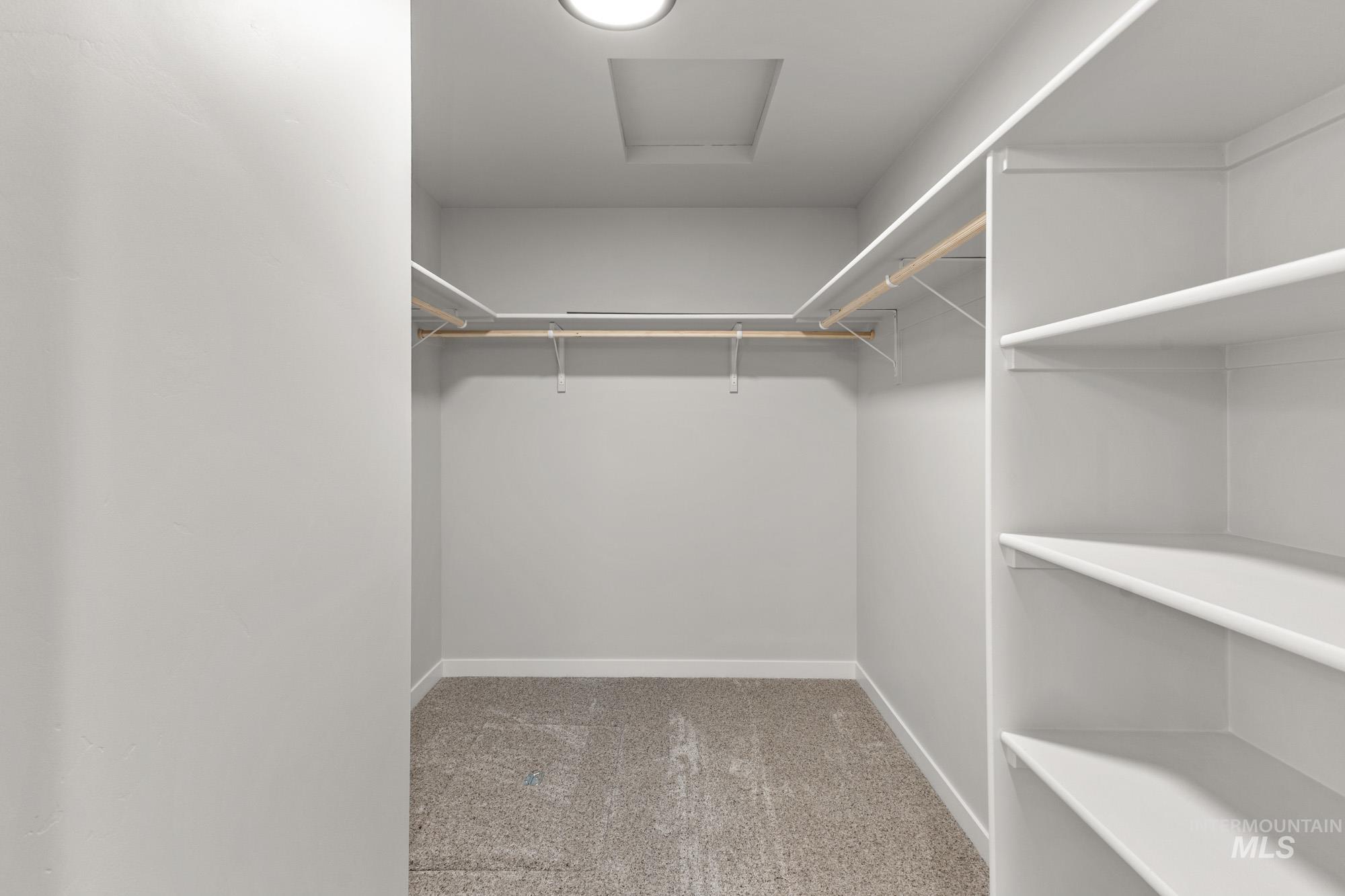 13307 Bank Street Caldwell, ID 83607 - Photo 20 of 20 Recessed ceiling lighting, durable carpet flooring, built-in shelving, and hanging rods