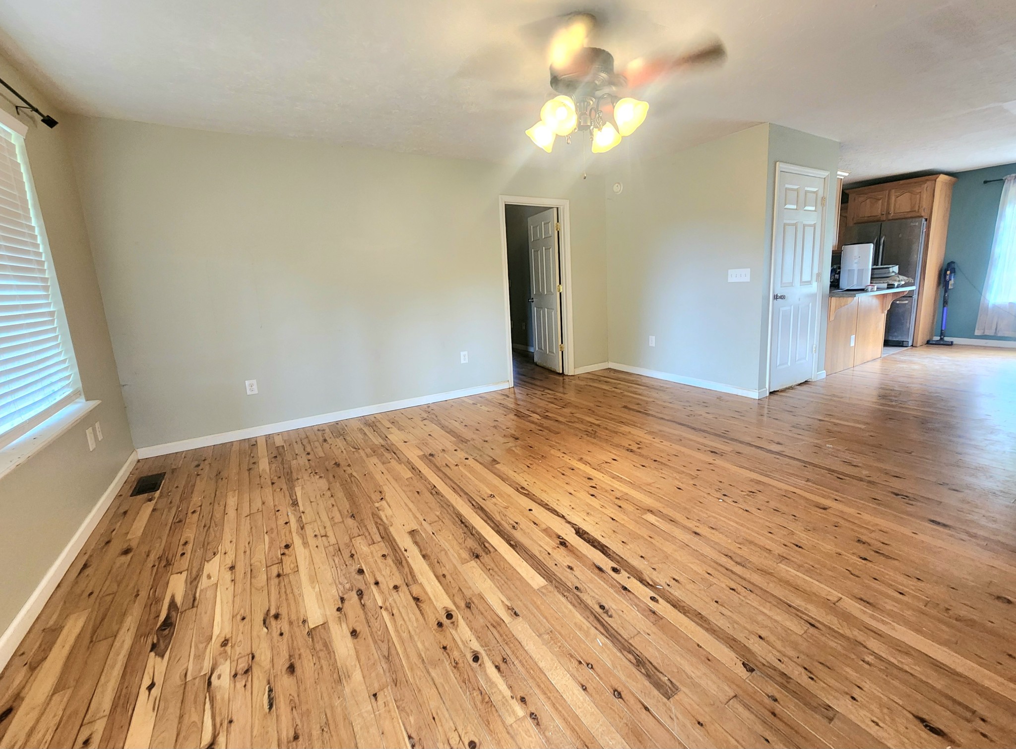 3586 Rock Springs Road Watertown, TN 37184 - Photo 7 of 10 a view of empty room with wooden floor and fan