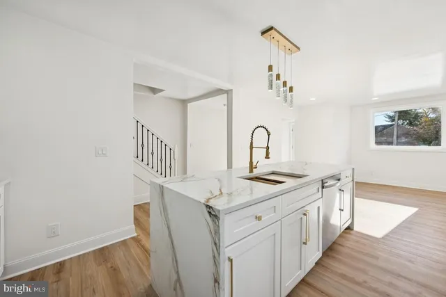 a view of a kitchen from a hallway