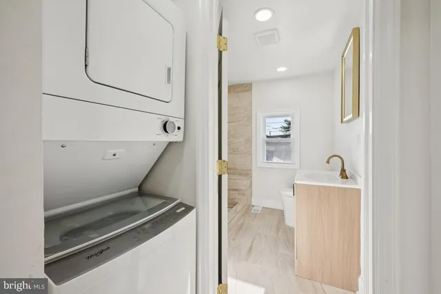 a view of kitchen and hallway with a microwave