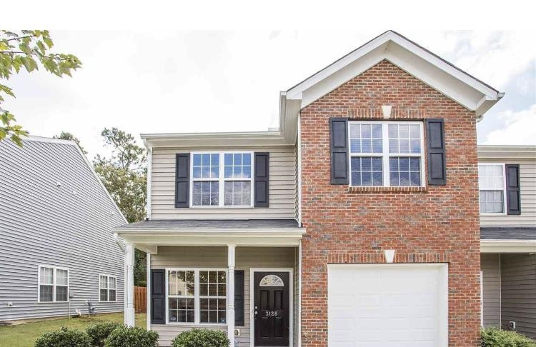 3128 Binghampton Lane Raleigh, NC 27604 - Photo 1 of 9 a front view of a house with a yard